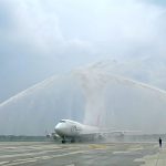 AtraditionalwatercannonsaluteforOneAirsfirstflightasitspreparestotakeoffinChina